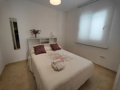 Cama o camas de una habitación en Apartamento Playa del Faro