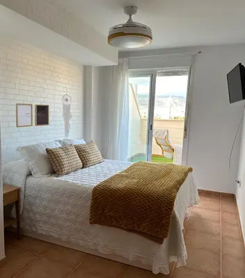 Cama o camas de una habitación en Ático junto al Auditorio con Terraza Privada y Parking