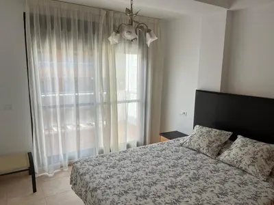 Cama o camas de una habitación en APARTAMENTO COSTA REY