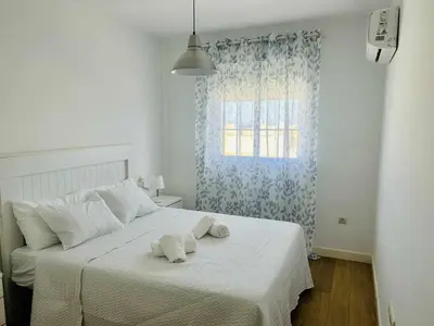 Cama o camas de una habitación en Casa Tino 500m Playa Terraza Garaje Piscina
