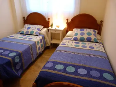 Cama o camas de una habitación en Apartamento Vereda Golf playa, piscinas y zonas verdes