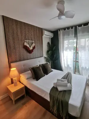 Cama o camas de una habitación en El Palmeral en Aguadulce Apto para 4 personas con AC, Wifi y Piscina