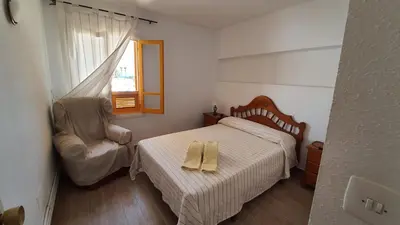 Cama o camas de una habitación en APARTAMENTO CON PISCINA EN MOJACAR PLAYA
