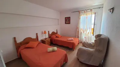 Cama o camas de una habitación en APARTAMENTO CON PISCINA EN MOJACAR PLAYA