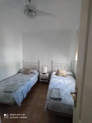 Cama o camas de una habitación en La Casa de las Tejas Verdes