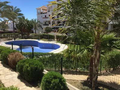 Piscina en o cerca de Apartamento increible, Playazo de Vera, 3 habitaciones, segunda línea de Playa