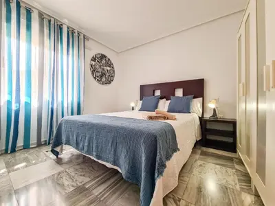 Cama o camas de una habitación en Avenida Guillermo Reina 1ºB