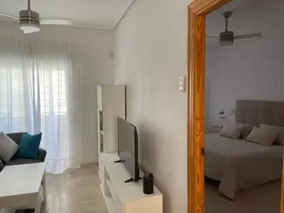 Una televisión o centro de entretenimiento en Apartamento Vive Garrucha