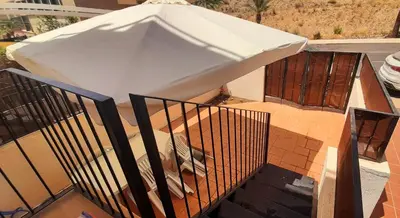 Un balcón o terraza de La casa de la fama - Apartamento con patio exterior