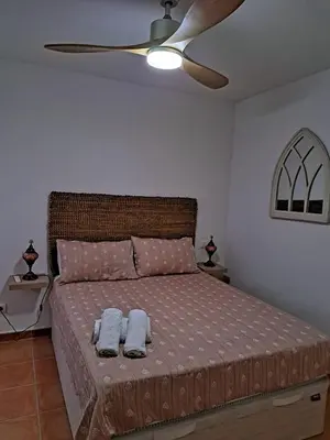 Cama o camas de una habitación en La casa de la fama - Apartamento con patio exterior