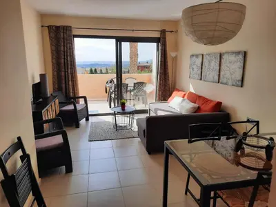 Una televisión o centro de entretenimiento en Golf Penthouse Valle del Este Vera 116, Las Moreras