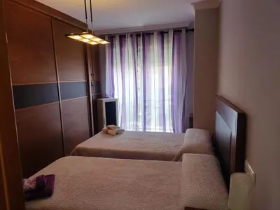 Cama o camas de una habitación en piso 3 habitaciones urbanizacion