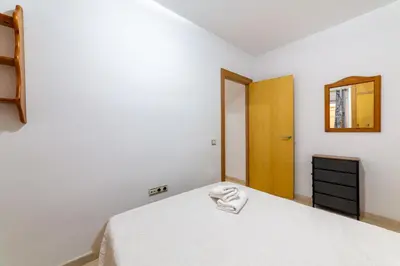 Cama o camas de una habitación en AlmeriaSuite Beach&Sun