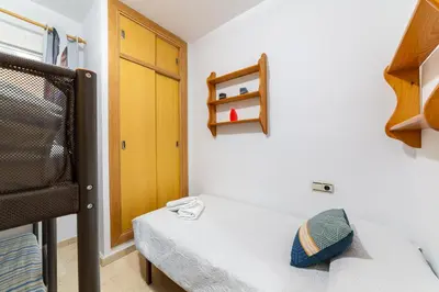 Cama o camas de una habitación en AlmeriaSuite Beach&Sun