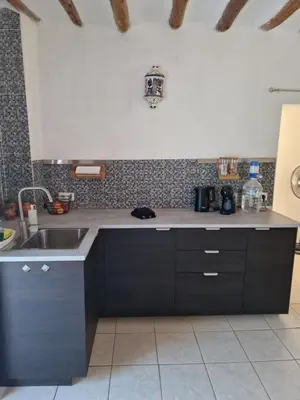 Una cocina o zona de cocina en Casa De La Familia - Appartement