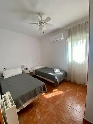 Cama o camas de una habitación en Duplex con terraza en Agua Amarga
