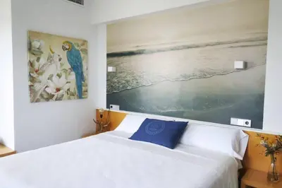 Cama o camas de una habitación en Hotel Alboran