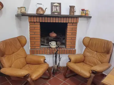Zona de estar de Casa en el valle de GuainosAltos