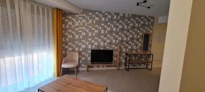 Una televisión o centro de entretenimiento en BYS SANTA FE APARTAMENTOS TURISTICOS