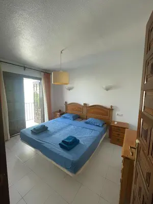 Cama o camas de una habitación en La Casa de Flores