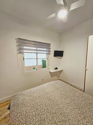 Cama o camas de una habitación en Elegante apartamento de diseño.