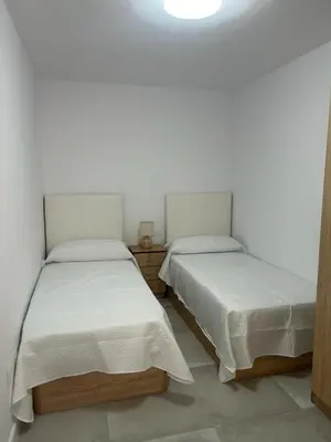 Cama o camas de una habitación en Apartamentos MILANO