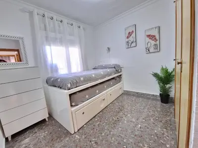 Cama o camas de una habitación en Apartamento Las Gaviotas Aguadulce con Piscina y Jardin