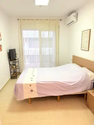 Cama o camas de una habitación en Lago De Almerimar Three Bedroom Beach Front Apartment