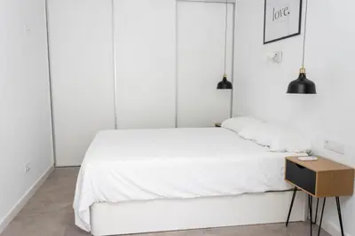 Cama o camas de una habitación en Bajo con patio, Calle Cañada Aguilar 10