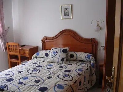 Cama o camas de una habitación en Hostal Asensio Nijar