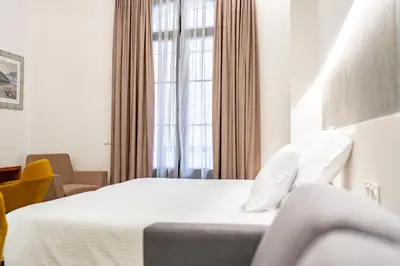 Cama o camas de una habitación en Torreluz SUITES