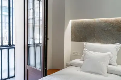 Cama o camas de una habitación en Torreluz SUITES