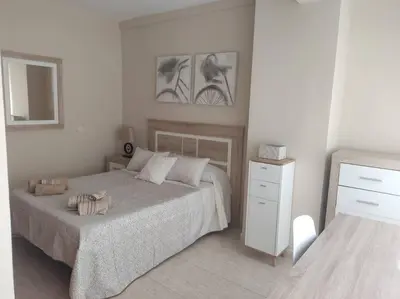 Cama o camas de una habitación en Acogedor Apartamento frente al mar Elena y Michele