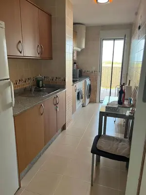 Una cocina o zona de cocina en Acogedor Apartamento