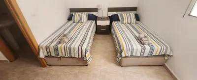 Cama o camas de una habitación en Dúplex en los Collados