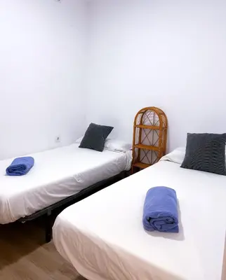 Cama o camas de una habitación en Casa con jardín