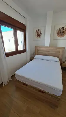 Cama o camas de una habitación en Apartamentos Bahia Mar casa B