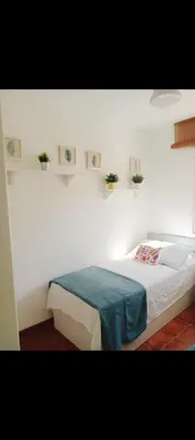 Cama o camas de una habitación en Casa familiar al lado de la playa