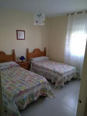 Cama o camas de una habitación en APARTAMENTO PUERTO GOLF