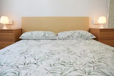 Cama o camas de una habitación en Luminoso apartamento que tiene amplia terraza, gran piscina y a 4 min de la playa