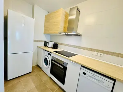 Una cocina o zona de cocina en AquaHome- Precioso apartamento con piscina, 3 minutos a pie de Vera Playa