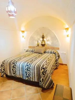 Cama o camas de una habitación en Casa Cueva The Exclusive Royal Andalusian Cave