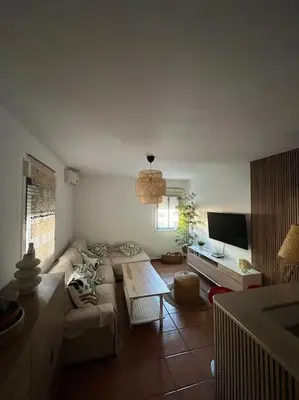 Una televisión o centro de entretenimiento en Apartamento en Las Negras
