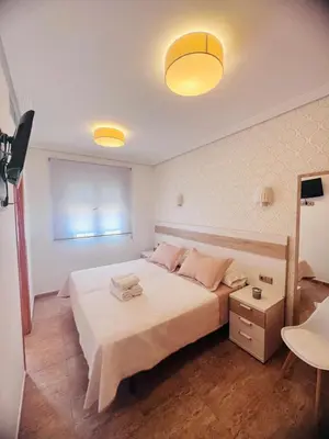 Cama o camas de una habitación en PENSION NAVAS