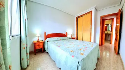Cama o camas de una habitación en Apartamento dos dormitorios Veramar 5 1ª línea de playa con vistas al mar