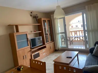 Una televisión o centro de entretenimiento en Apartamento Portofino Sun & Beach