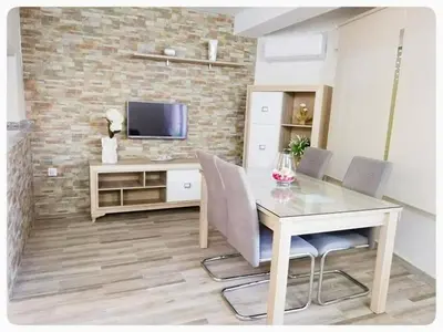 Una televisión o centro de entretenimiento en MEDITERRÁNEO PLAYA