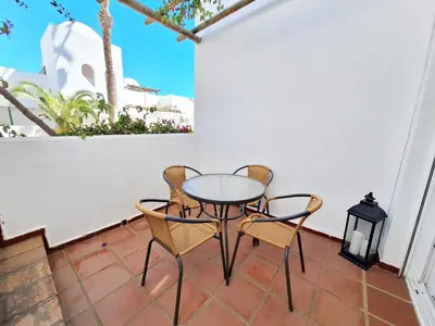 Un balcón o terraza de Torrelaguna Atico - WiFi, terraza & piscina comunitaria