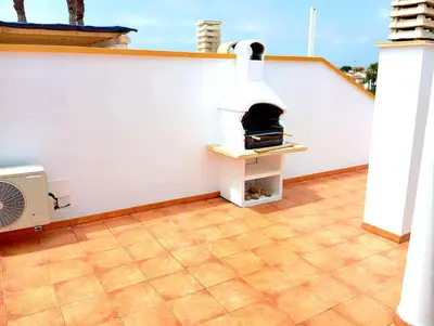 Un balcón o terraza de Ático con solarium Veramar 4 dos dormitorios en 1ª línea de playa