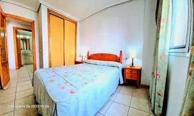 Cama o camas de una habitación en Ático con solarium Veramar 4 dos dormitorios en 1ª línea de playa
